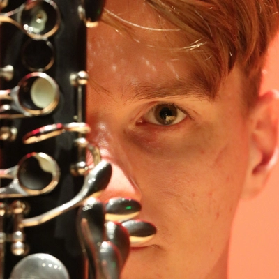 Tyler Mazone with an instrument