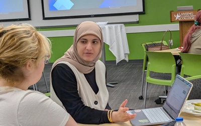 Aesha Zakaria with an Envision Green student