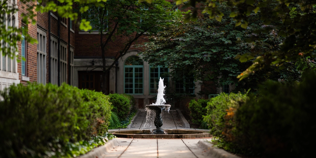 A bubbling fountain outside Mary Mayo Hall