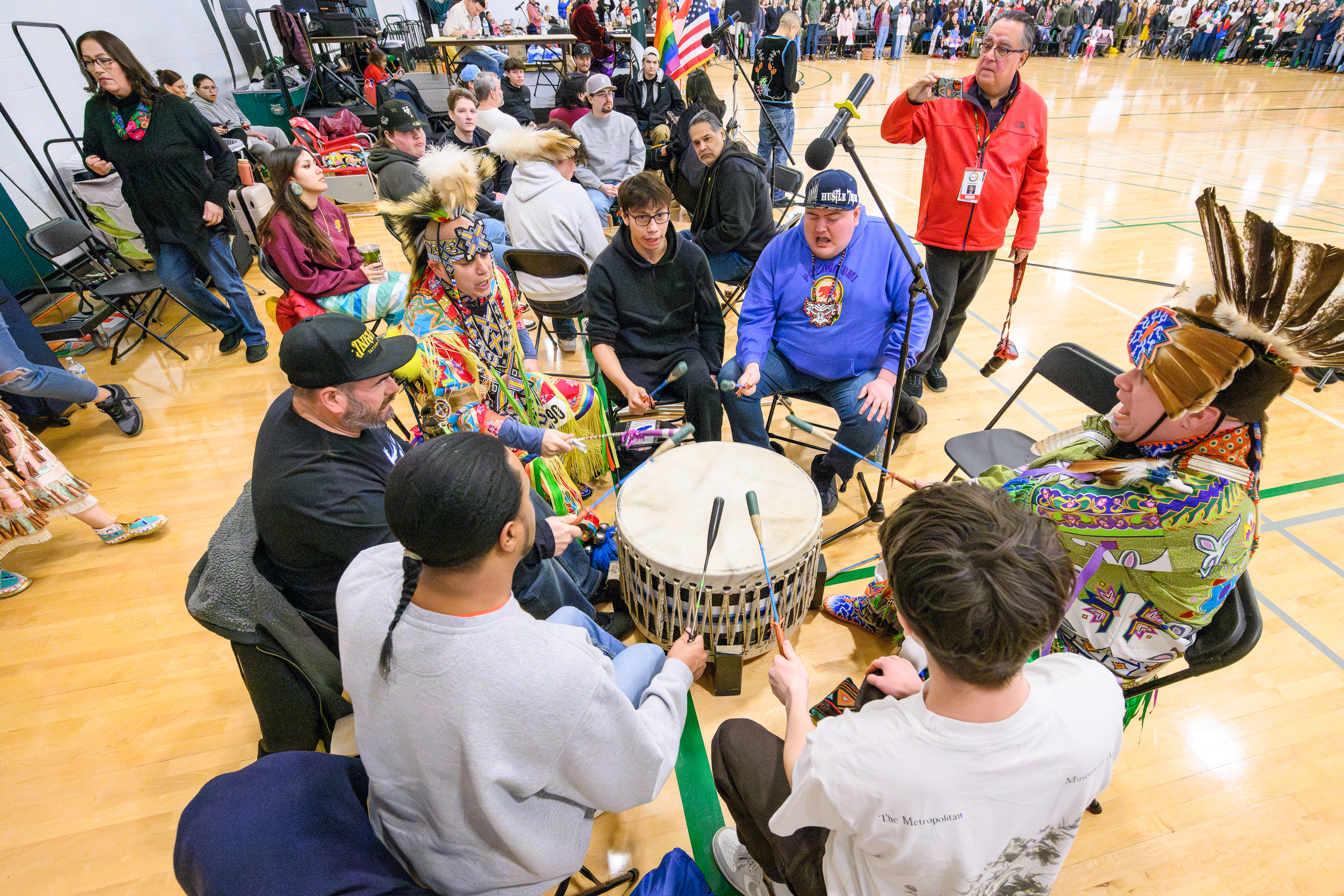 powwow drummers sitting in a circle