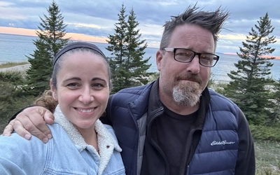 Jennifer Wargo with husband on the shores of Lake Michigan