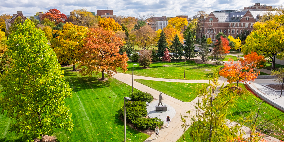 Students traverse Hannah Plaza on a fall day.