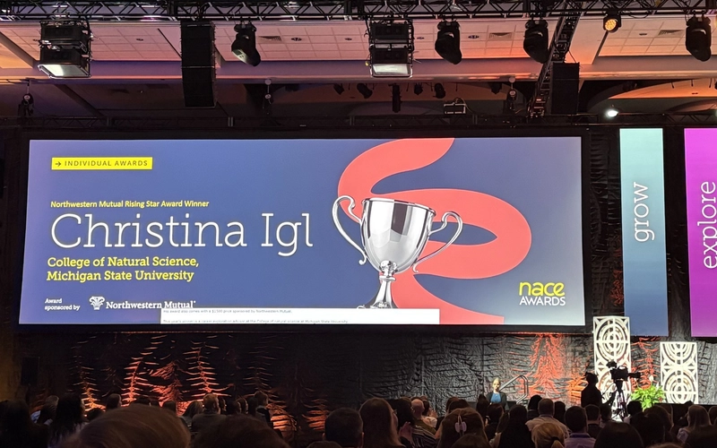 Stage screen displaying Christina Igl as the NACE Rising Star Award winner