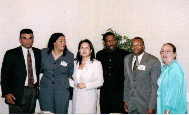 A group photo of staff members from the 1980s