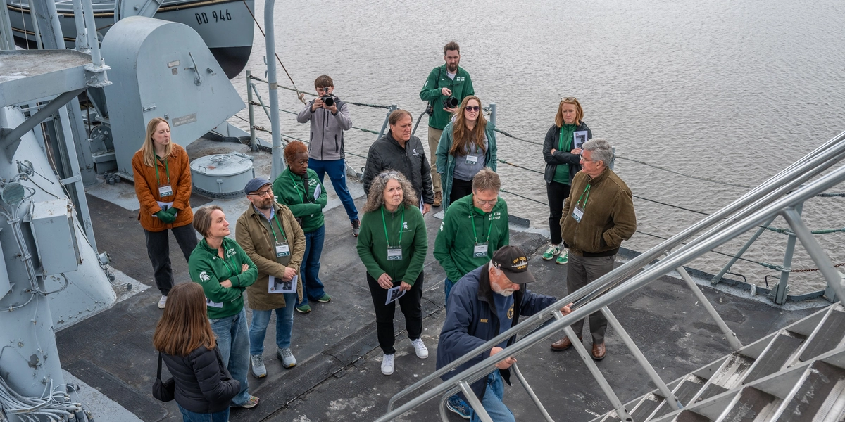 A group of people on board the USS Edson