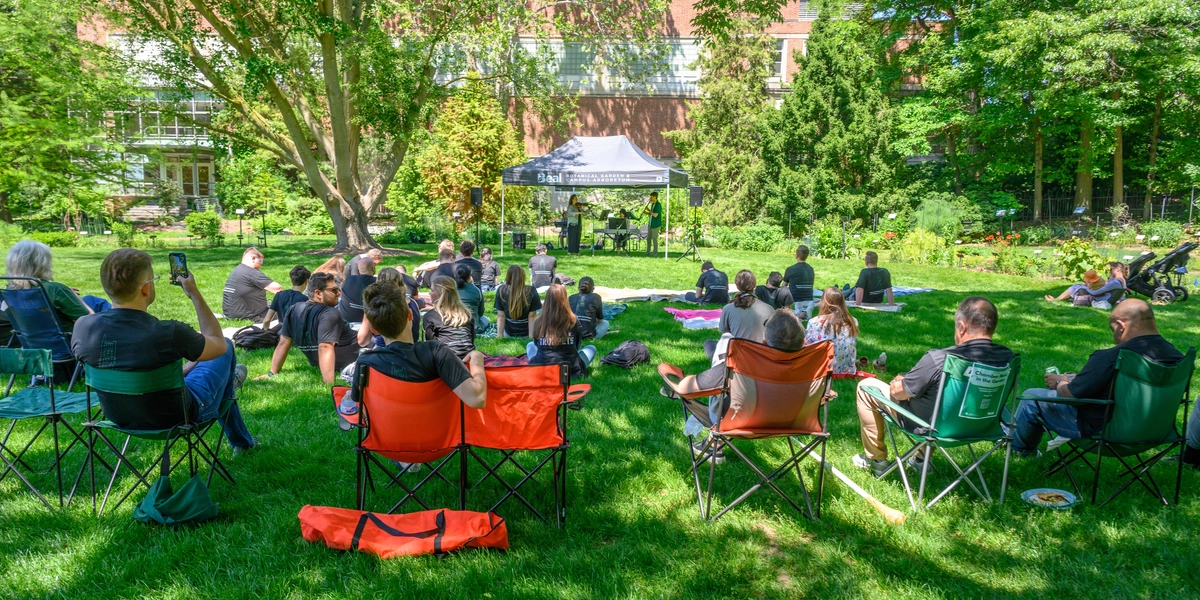 People listening to concert in Beal Botanical Garden