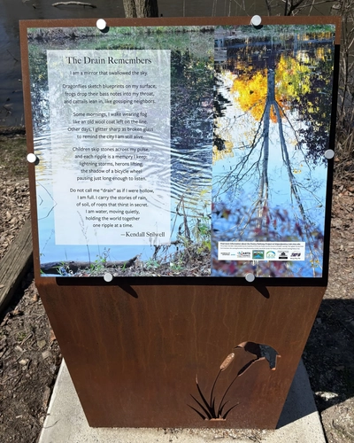 The Drain Remembers poem on a plaque at the wetlands