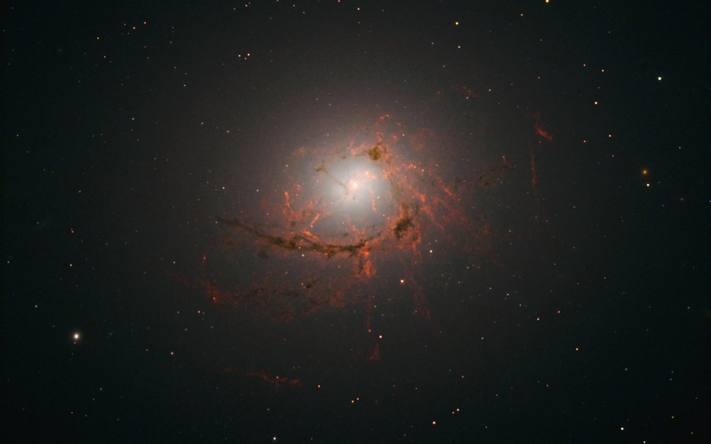 An image showing filaments in space that are swirling, surrounded by stars in the black space all around.