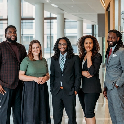 A photo of the TRIO Student Support Services staff. Five individuals of mixed race and gender.