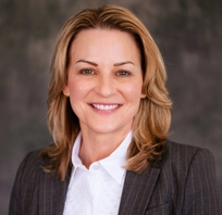 Headshot of Laura Rugless.