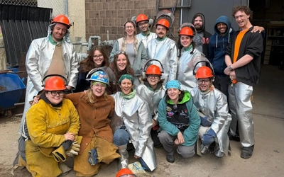 MSU students and faculty gather together for a group photo.