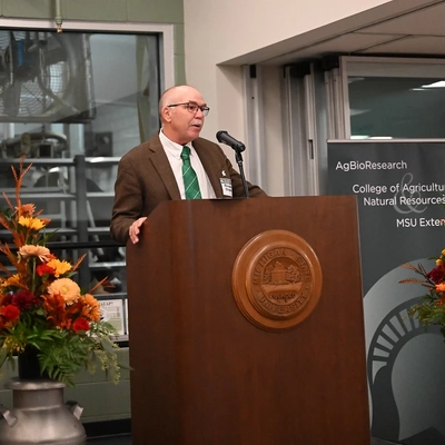 Man standing at podium speaking