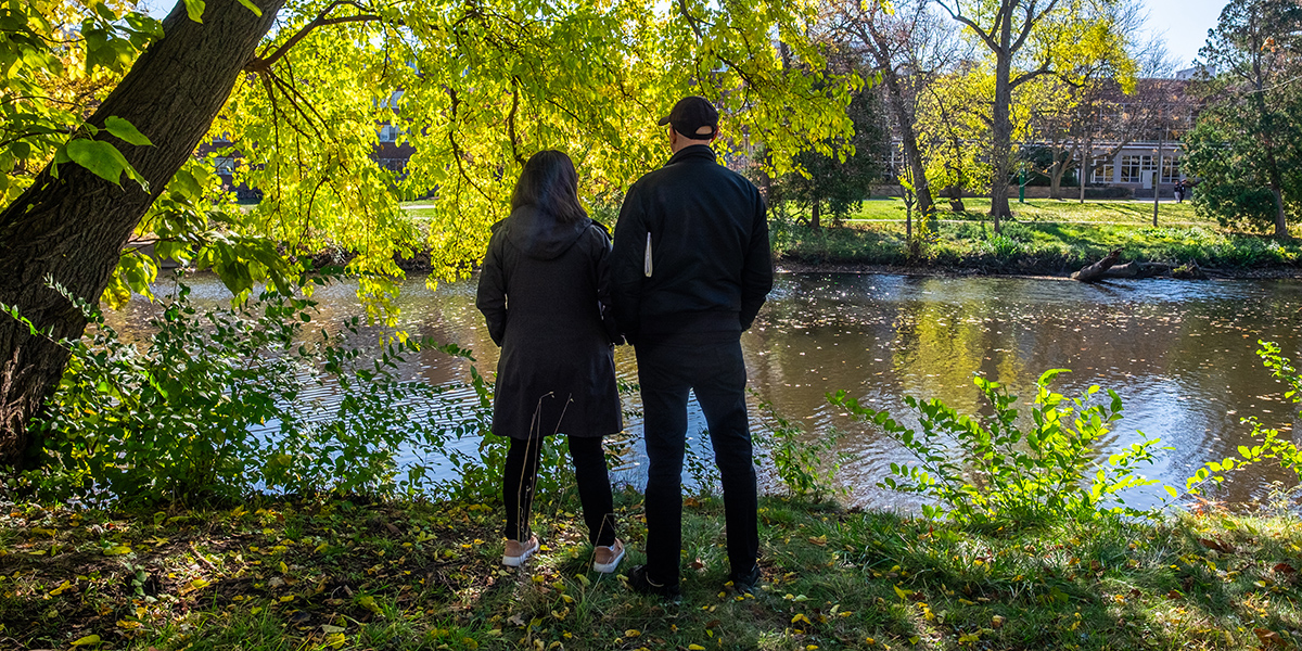 Autumn leaves and student silhouette on an autumn day.