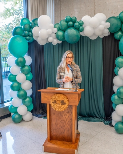 Laura Lee McIntyre at a Ribbon Cutting Ceremony