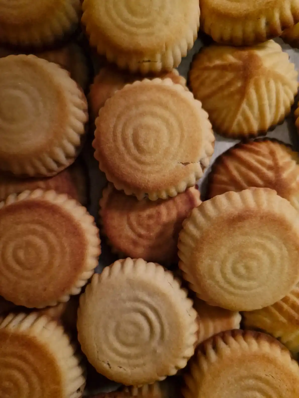 dozens of round cup-cake-shaped bread pastries