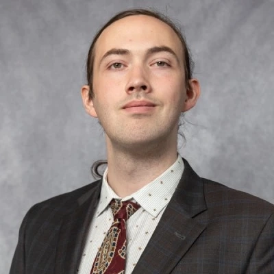 A portrait of a smiling Levi Rinck.