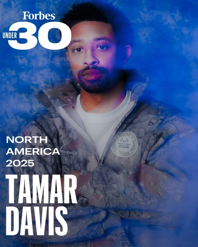Tamar Davis in a camo jacket on a Forbes Under 30 North America 2025 social graphic.