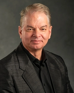 Portrait of a smiling Christoph Adami.