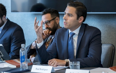 Raul Rodriguez speaking at an event while making a hand gesture