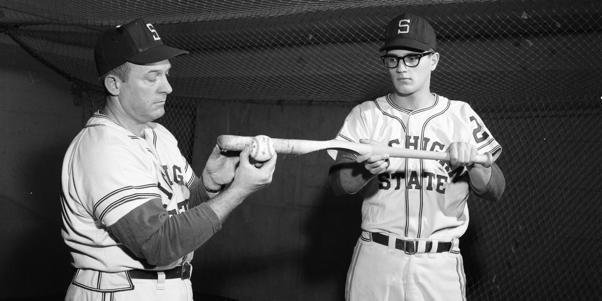 Coach Danny Litwhiler shows his Bunting Bat to an MSU Baseball player.