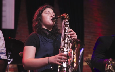 Sam Gucwa plays saxophone among other muscians