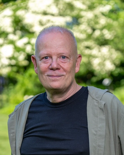 A portrait of a smiling Professor Björn Hamberger.