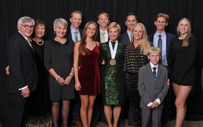 Bonnie Larson, wearing her 2023 MSU Philanthropist Award medallion, poses with members of her family at the MSU Alumni Grand Gala.