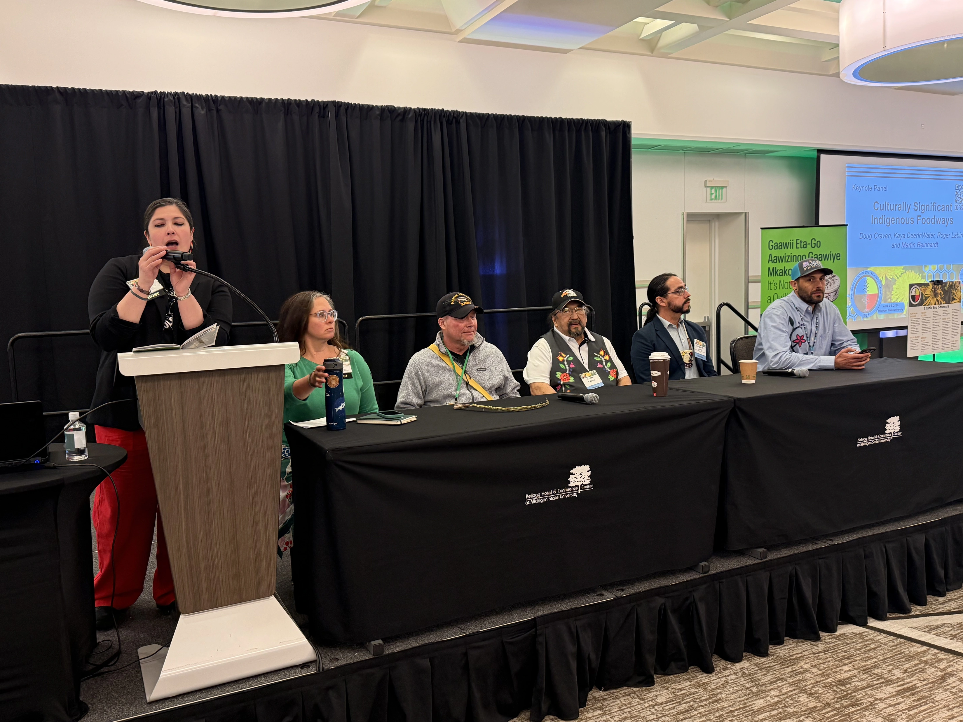 panelists sit at a table