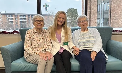 Three people sitting on a couch