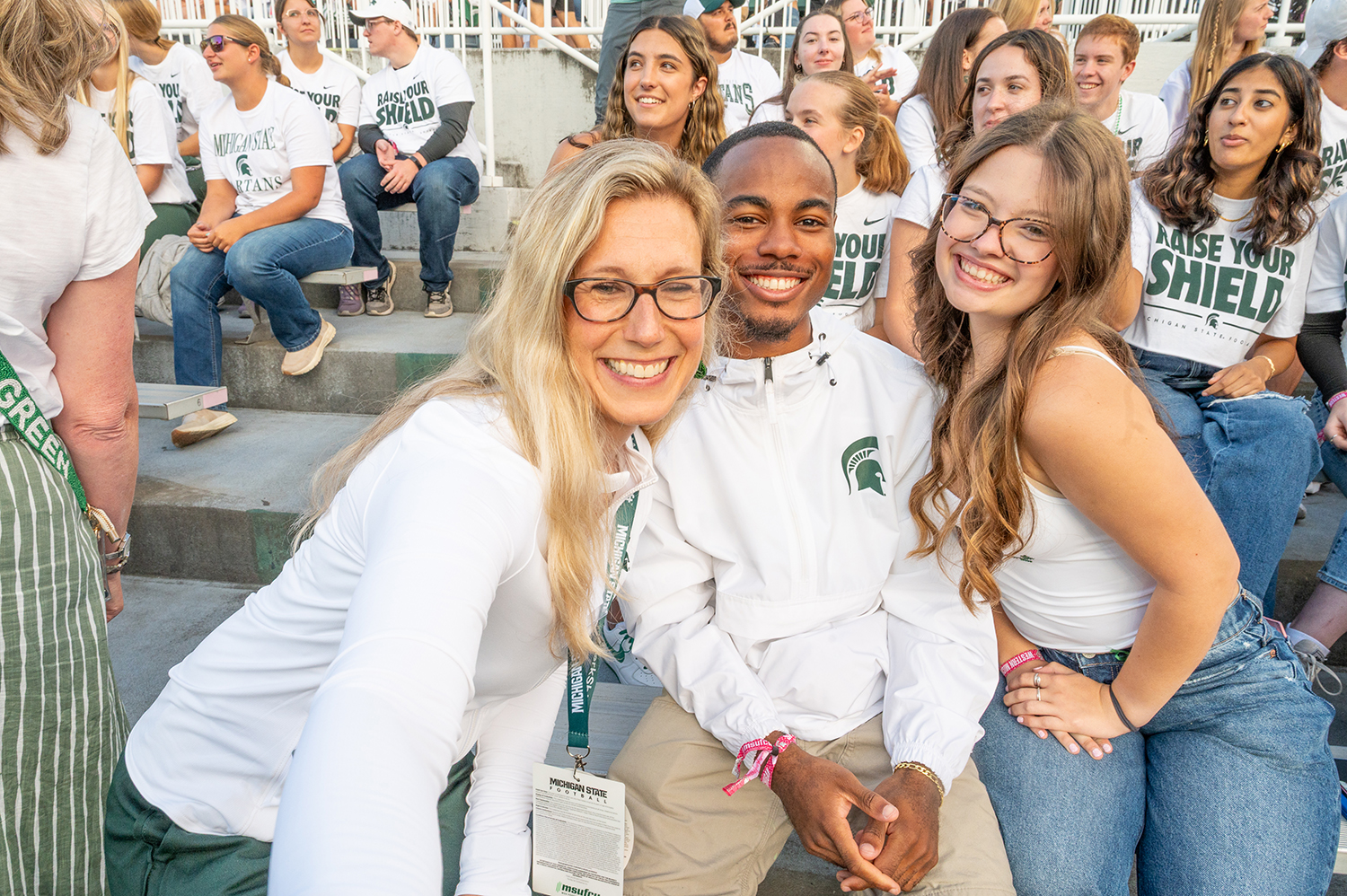 Laura Lee McIntyre with students on the first football game of the season