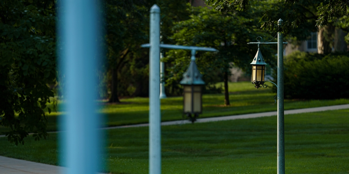 Lanterns lining a sidewalk on campus