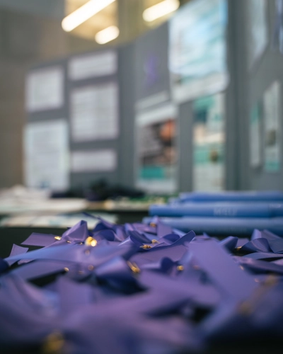 A closeup of purple ribbons on a table.