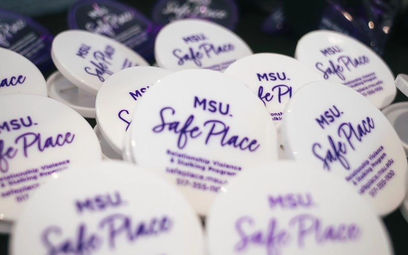 Closeup of Safe Place pins on a table.