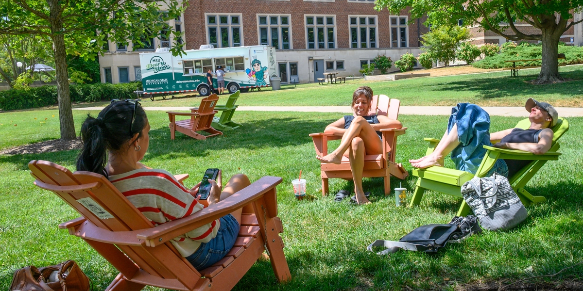 People lounging in Adirondack chairs