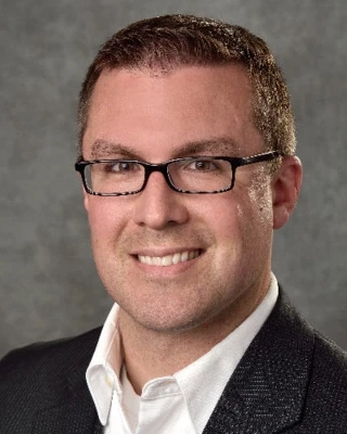 Portrait of a smiling Tim Gates.