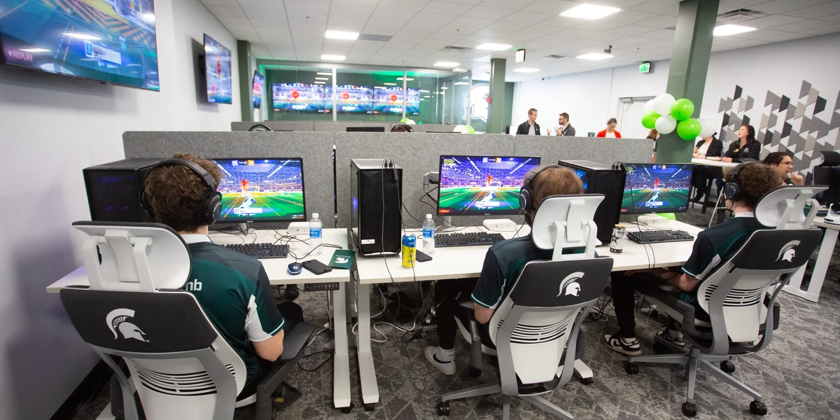 Students playing videogames at Hubbard Esports Gaming Hub.
