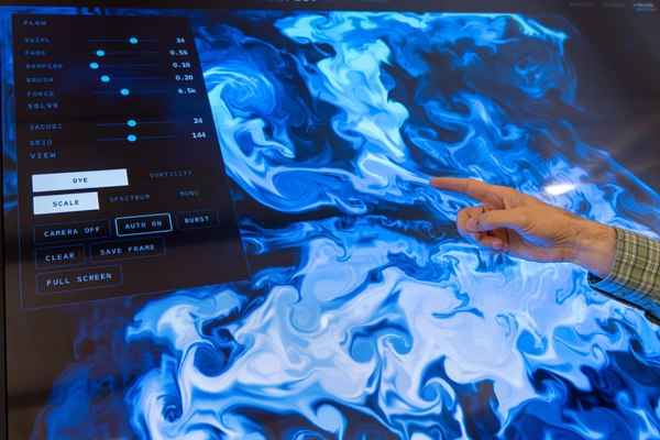 Swirls of white, and shades of blue are visible on the screen to show turbulent movement.
