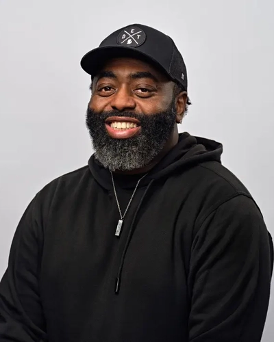 Portrait of a smiling Curtis L. Lewis.