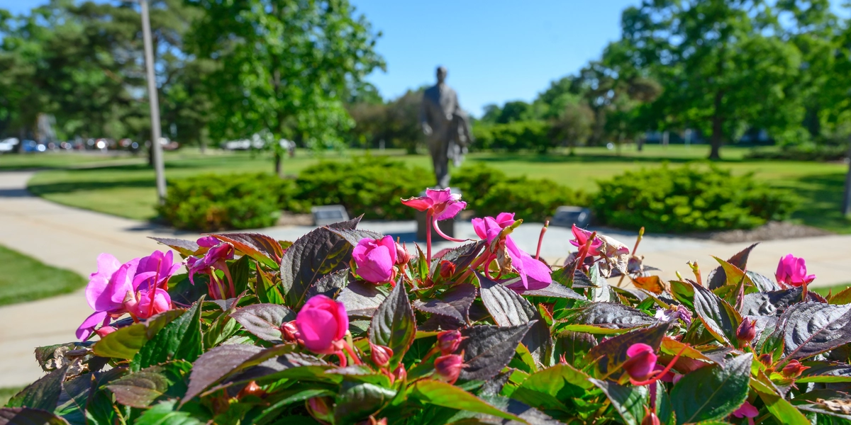 Flowers in front of John Hannah statue