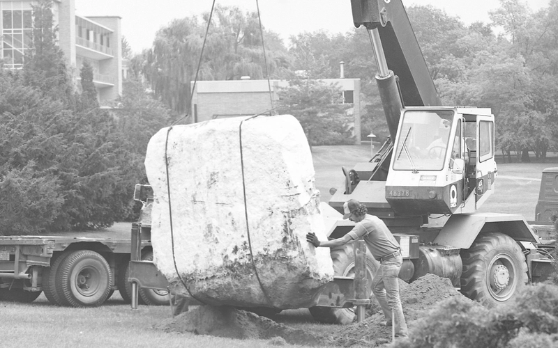 The Rock at MSU, a landmark of the university, being moved to a new location in 1985 by a crane