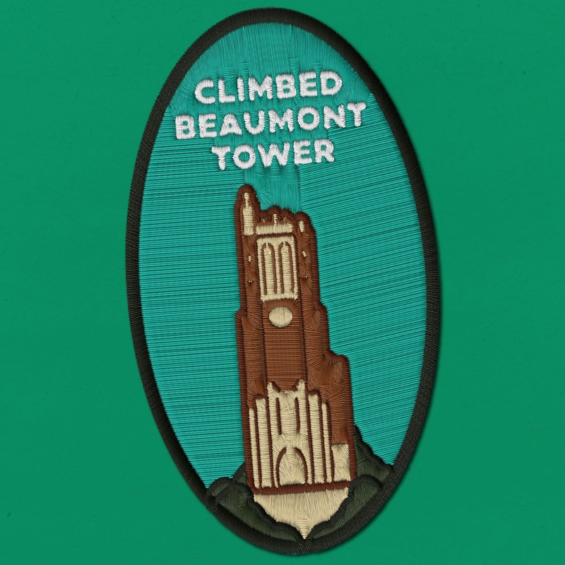 Embroidered patch reading "Climbed Beaumont Tower" with an image of the tower with green background.