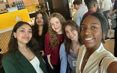 Five people pose for a selfie at James Madison College's Spring 2025 Career Exposure Program to Chicago.