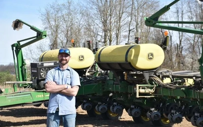 Bryan Hammis in front of tractors