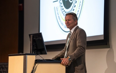 MSU President Kevin Guskiewicz delivers the opening remarks at the Whittam-Brubaker Symposium