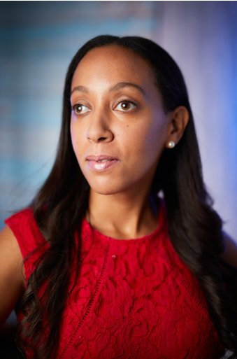 Woman with black hair, wearing a red top