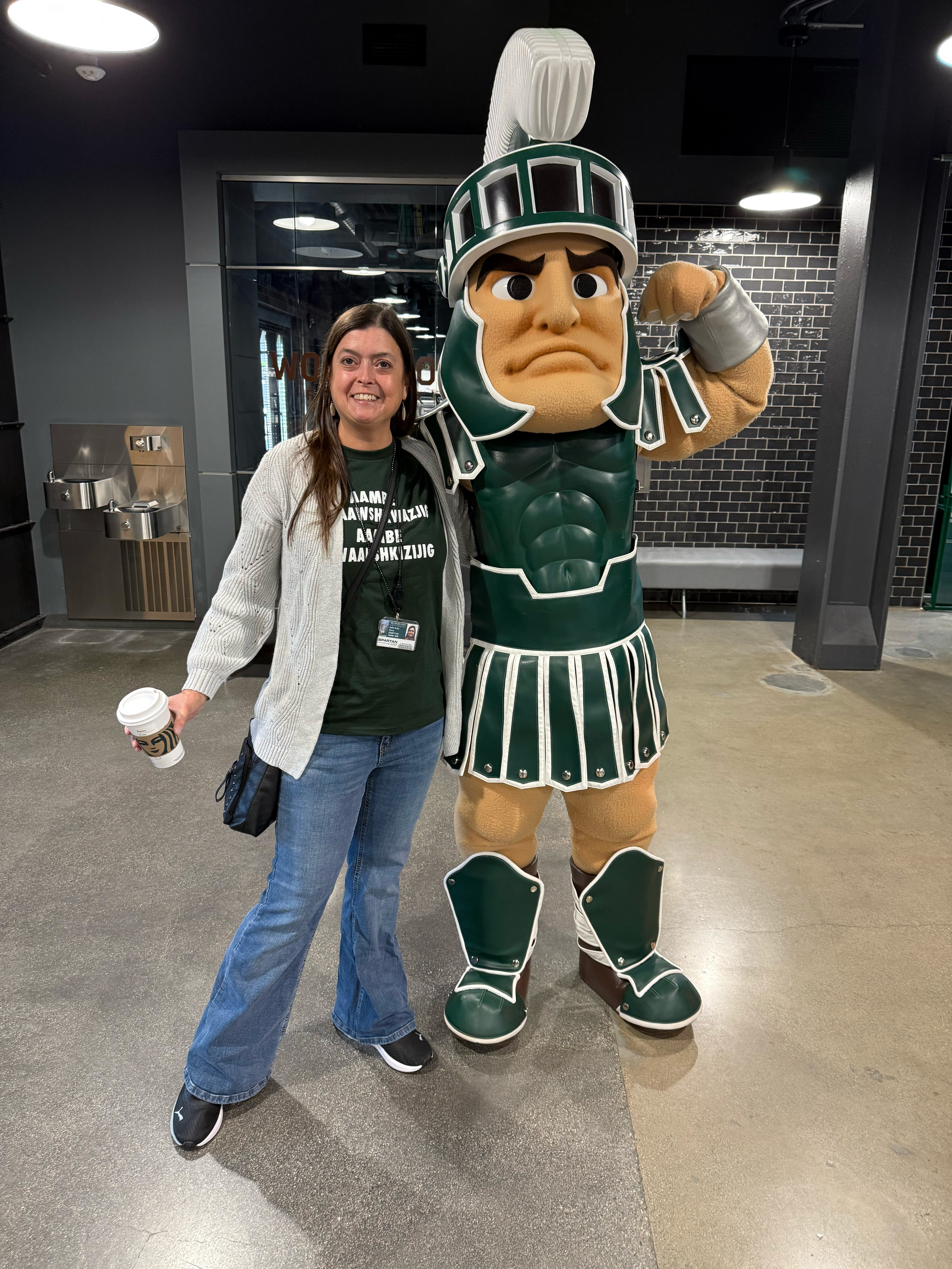 A woman poses with Sparty