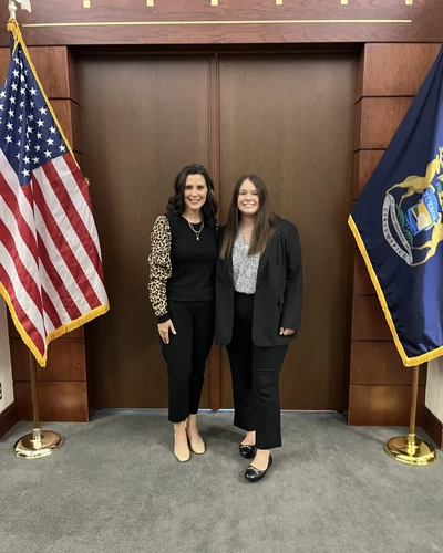 An MSU PR student standing next to Governor Gretchen Whitmer.
