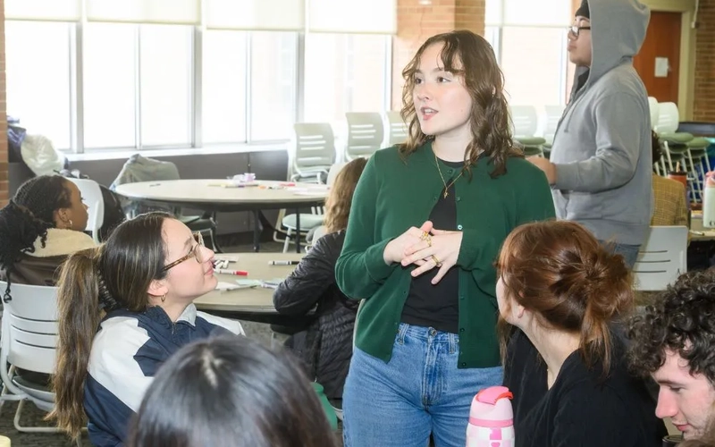 Ava parsons speaking with Ingham County high school students