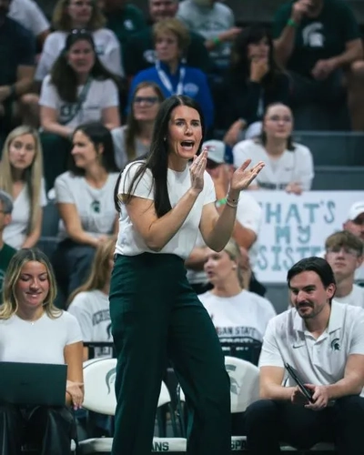 MSU’s volleyball head coach Kristen Kelsay claps hands during a game.