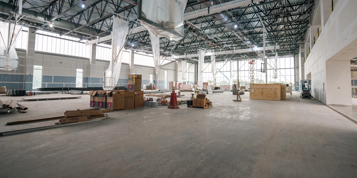 Construction of thee primary four-court gymnasium looking out on Shaw Lane and the Breslin Center.